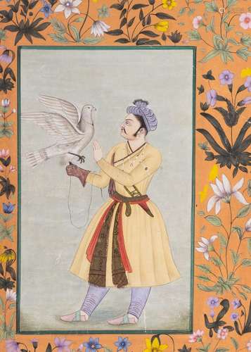 A FLORAL INDIAN MINIAUTRE OF A MAN AND A DOVE, RAJASTHAN, IN...