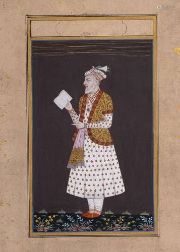 AN INDIAN MINIATURE OF AN OLD NOBLE MAN READING A BOOK, 19TH...