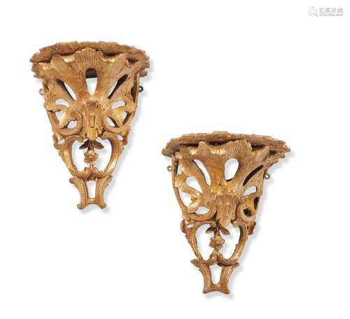 A PAIR OF GILTWOOD AND COMPOSITION WALL BRACKETS IN GEORGE I...