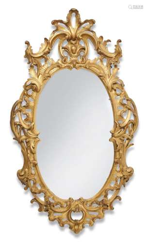 A GILTWOOD AND COMPOSITION WALL MIRROR IN GEORGE III STYLE, ...