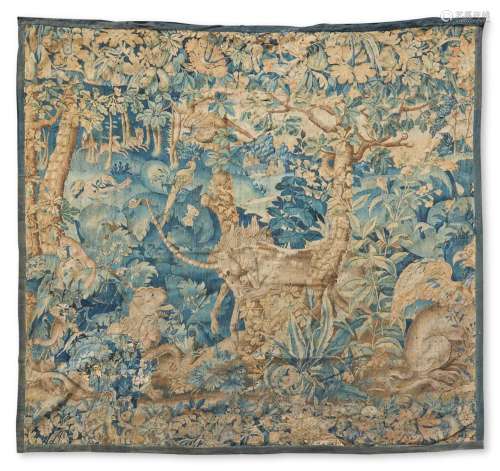 A FLEMISH TAPESTRY FRAGMENT WOVEN WITH A UNICORN, MID/LATE 1...