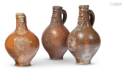 A GROUP OF THREE GERMAN SALT-GLAZED STONEWARE BOTTLE FLASKS,...