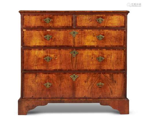 A WALNUT AND FEATHER BANDED CHEST OF DRAWERS, CIRCA 1740 AND...