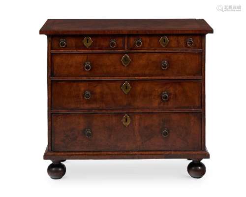 A WALNUT CHEST OF DRAWERS , OF 'BACHELOR' TYPE, EARLY 18TH C...