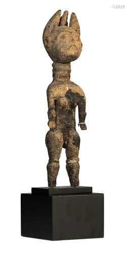 A carved and patinated wooden ritual figure, Abron (Ghana), ...