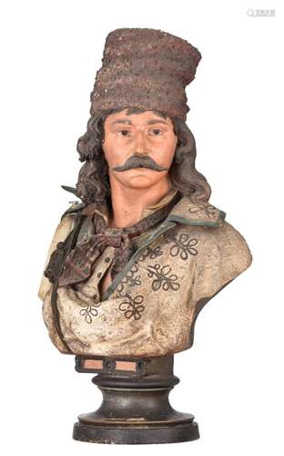 A polychrome painted terracotta bust of a pastoral Balkan fi...