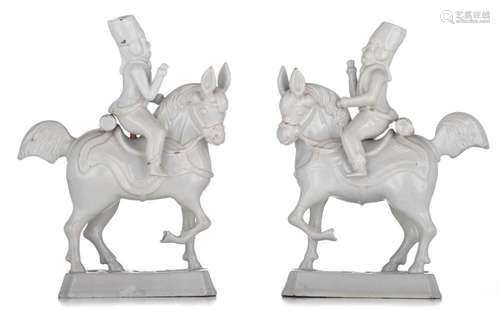 An exceptional pair of Delft white-glazed figures of horseba...