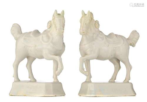 A pair of Dutch Delft white-glazed figures of circus horses,...