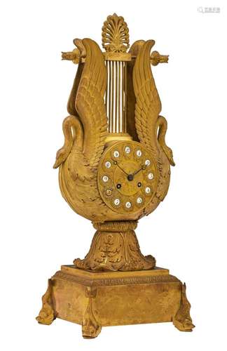 A gilt bronze lyre-shaped Restauration mantle clock, decorat...