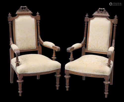 A PAIR OF VICTORIAN WALNUT ARMCHAIRS