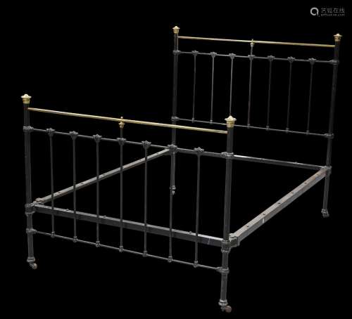 A VICTORIAN BRASS AND CAST IRON BED