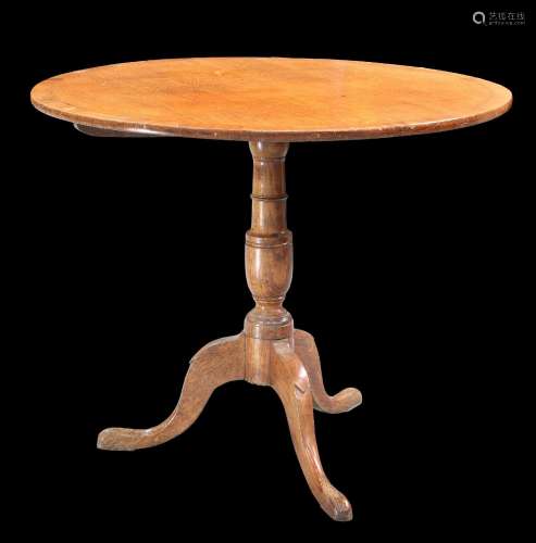 A GEORGE III MAHOGANY-CROSSBANDED OAK TILT-TOP TRIPOD TABLE