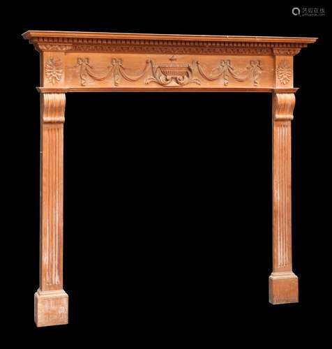 A VICTORIAN OAK PANELLED FIRE SURROUND