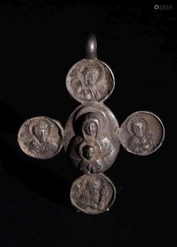 A BYZANTINE SILVER CROSS DEPICTING PANELS OF CHRIST & MO...