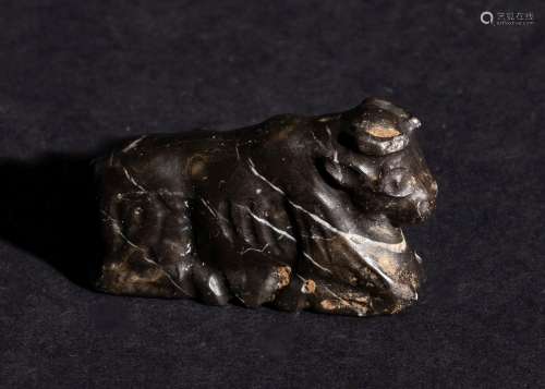 A CARVED BLACK STONE FIGURE OF A BULL 3300-2900 B.C. OR LATE...