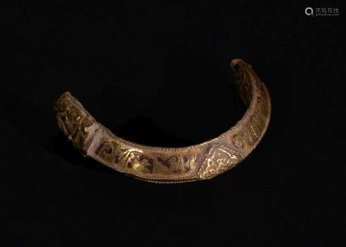 A PART GOLD FRAGMENT OF A BANGLE WITH INSCRIPTION, FATIMID O...