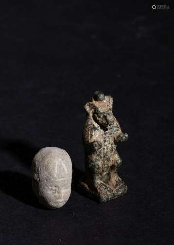 AN EGYPTIAN CLAY HEAD FIGURE OF A PHAROH & A CARVED GRAN...