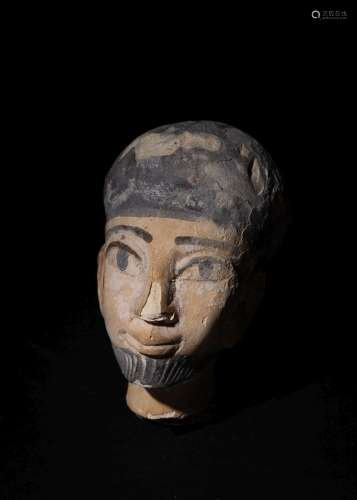 AN EGYPTIAN POLYCHROME LIMESTONE HEAD OF A DIGNITARY, NEW KI...