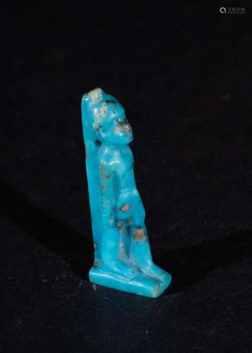 AN EGYPTIAN FAIENCE AMULET OF A PHAROH, PTOLEMAIC PERIOD CIR...