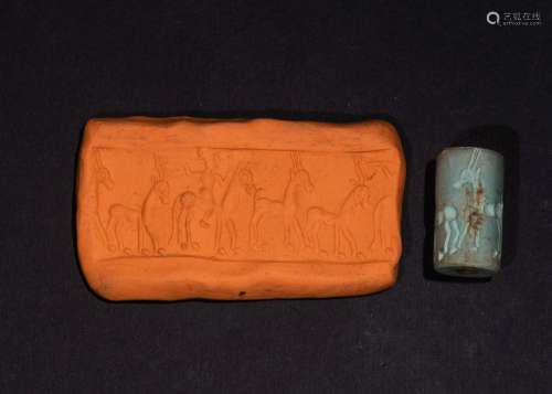A WESTERN ASIATIC TURQUOISE COLOURED STONE CYLINDER SEAL