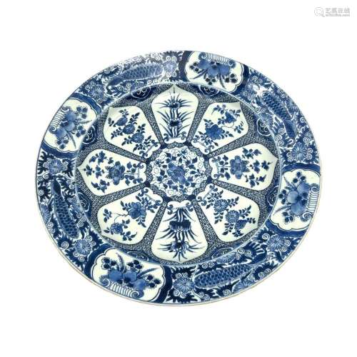 A blue and white large plate, the central roundels in the sh...
