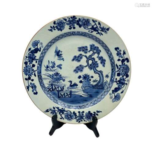 A Chinese blue and white plate, the roundel with Mandarin du...
