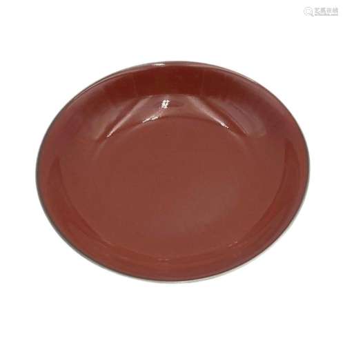 A monochrome red glazed dish, with a Yongzheng mark, diamete...