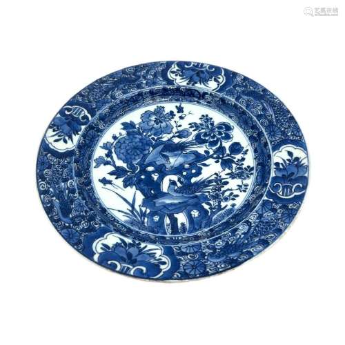 A Chinese blue and white plate, decorated with a pheasant in...