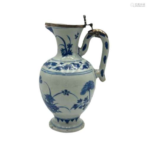 A Chinese blue and white floral decorated jug, Chongzheng/Tr...