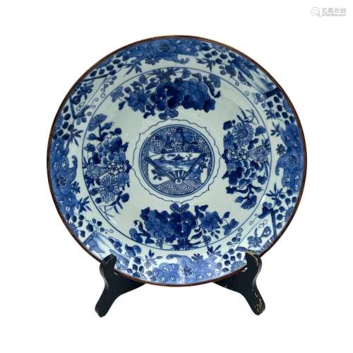 A blue and white flower plate, the central roundel decorated...