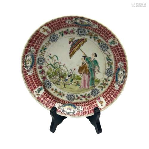 A famille rose export dish, decorated with  Dame au parasol ...
