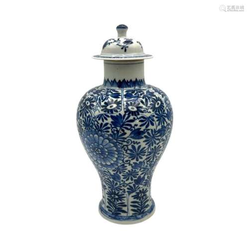 A Chinese blue and white floral decorated baluster vase and ...