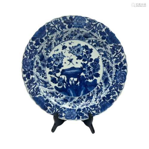 A Chinese blue and white deep plate, decorated with butterfl...