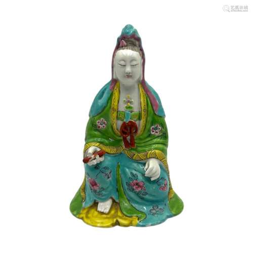 A Chinese famille rose enamelled figure of the seated Guanyi...