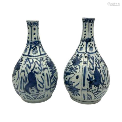 A pair of Chinese blue and white bottle vases, decorated wit...