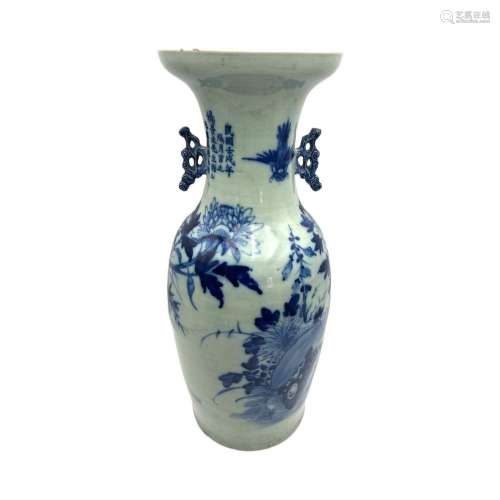 A Chinese blue and white vase, decorated with flowers and bi...