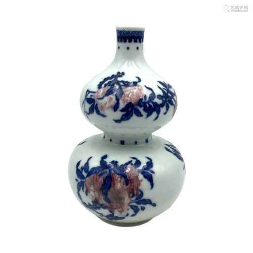 A Chinese copper red and underglaze blue double-gourd vase, ...