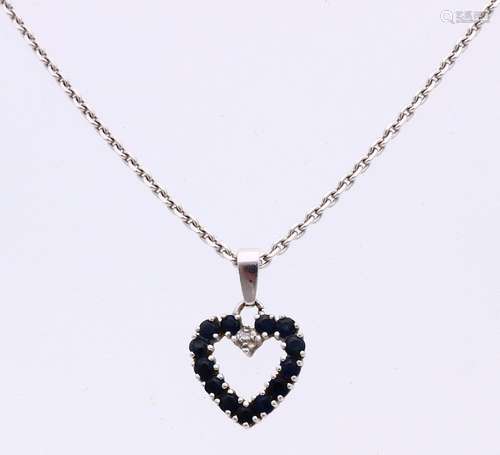 White gold necklace with heart pendant with sapphire