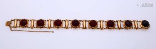 Gold bracelet with garnet