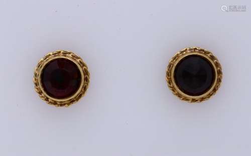 Gold ear studs with garnet