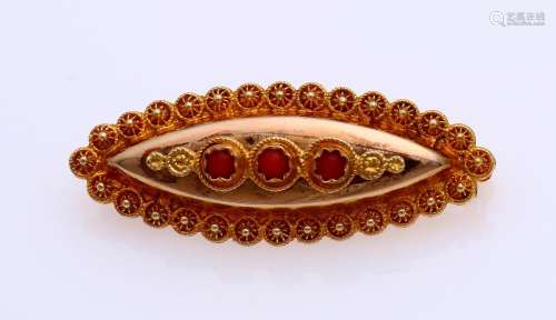 Gold brooch with red coral