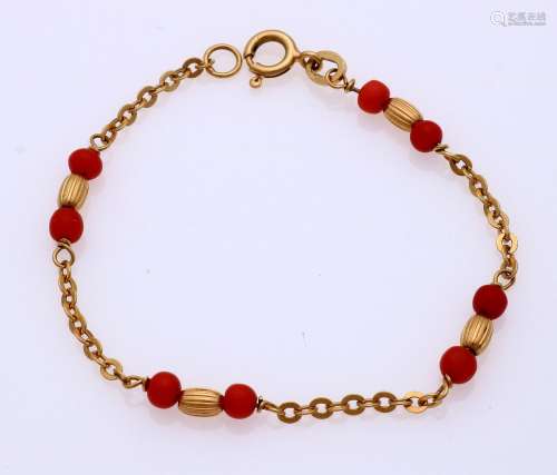 Gold bracelet with red coral