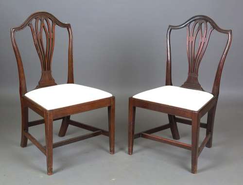 A set of ten George III pierced splat back dining chairs wit...