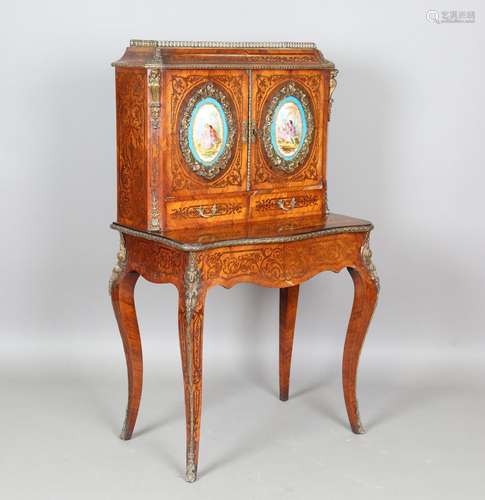 A mid-19th century kingwood and rosewood cabinet-on-stand wi...