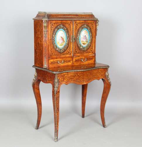 A mid-19th century kingwood and rosewood cabinet-on-stand wi...