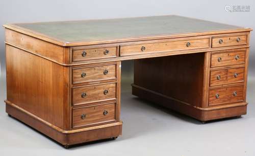 A mid-Victorian mahogany partners desk, the top inset with g...
