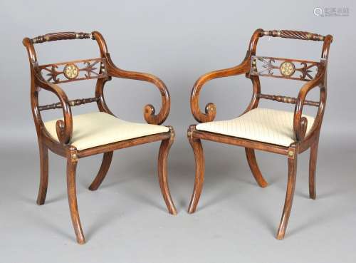 A set of eight Regency simulated rosewood and gilt brass mou...