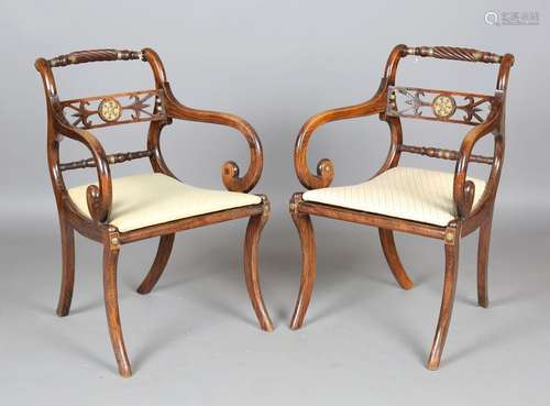 A set of eight Regency simulated rosewood and gilt brass mou...