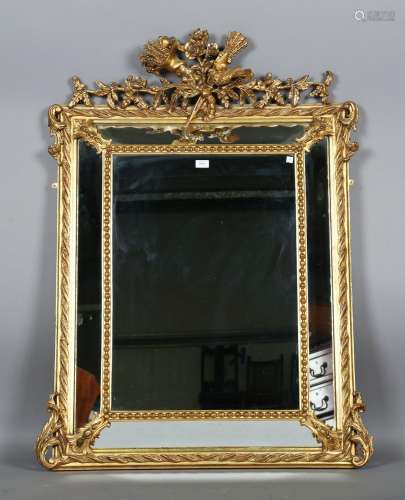 A 19th century gilt composition sectional wall mirror with a...