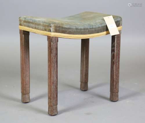 A George VI limed oak coronation stool with blue velvet seat...